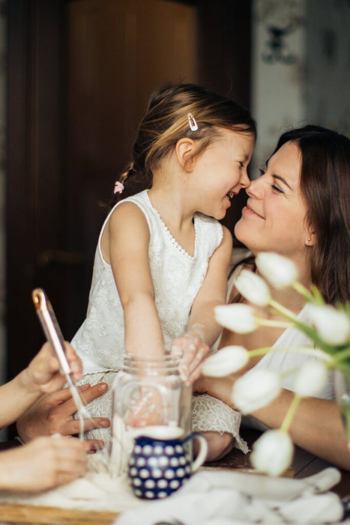 A joyful moment of a mother baking with her children in a cozy home environment.